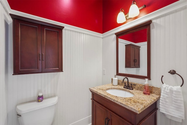 bathroom with toilet and vanity