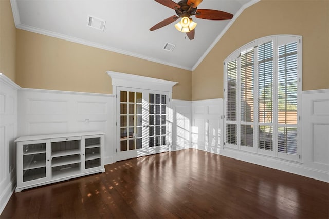 unfurnished living room with a healthy amount of sunlight, ceiling fan, crown molding, and lofted ceiling