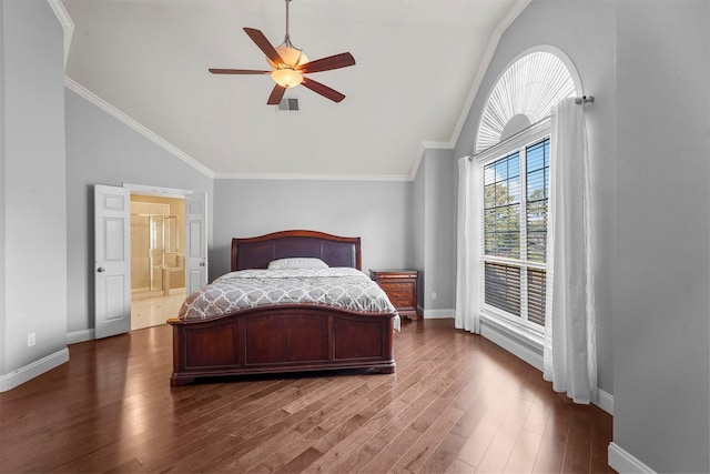 bedroom featuring ensuite bathroom, dark hardwood / wood-style flooring, ceiling fan, and ornamental molding