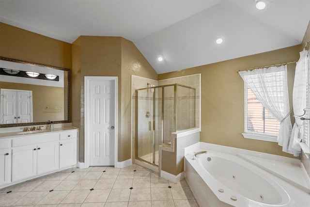 bathroom featuring independent shower and bath, tile patterned floors, lofted ceiling, and vanity