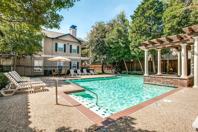 view of pool with a pergola and a patio area