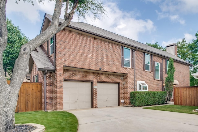 view of side of home with a garage