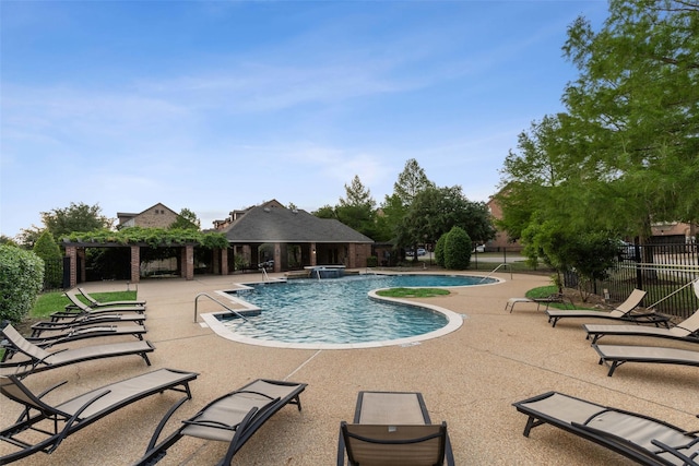 view of swimming pool featuring a pergola, pool water feature, and a patio area