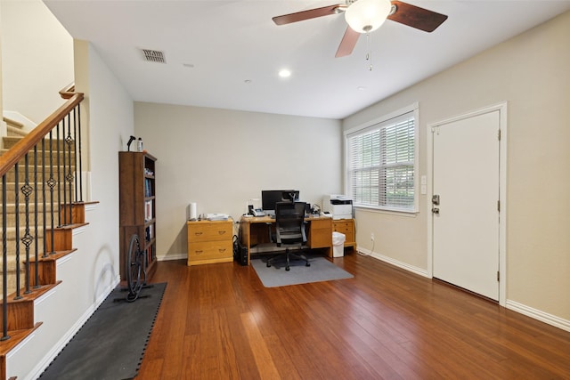 office with dark wood-type flooring and ceiling fan