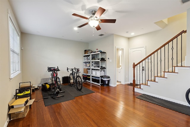 exercise room featuring ceiling fan and hardwood / wood-style floors