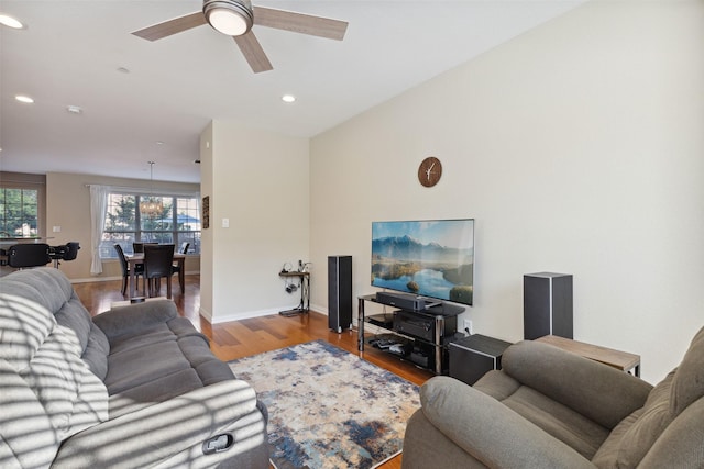 living room with ceiling fan and light hardwood / wood-style floors