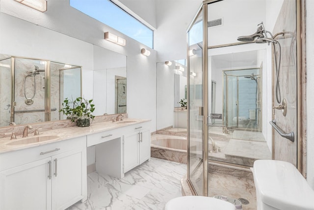 bathroom featuring vanity and separate shower and tub