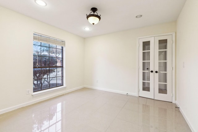 tiled empty room with french doors