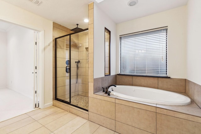 bathroom featuring plus walk in shower and tile patterned floors