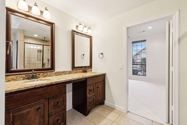 bathroom featuring walk in shower, tile patterned floors, and vanity