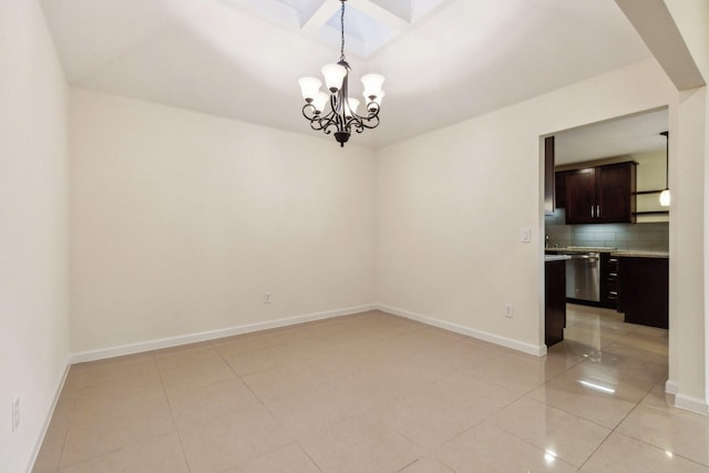 unfurnished room featuring an inviting chandelier and light tile patterned floors