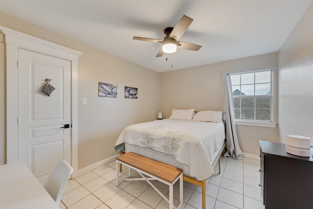 bedroom featuring light tile patterned flooring and ceiling fan