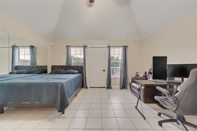 tiled bedroom featuring lofted ceiling