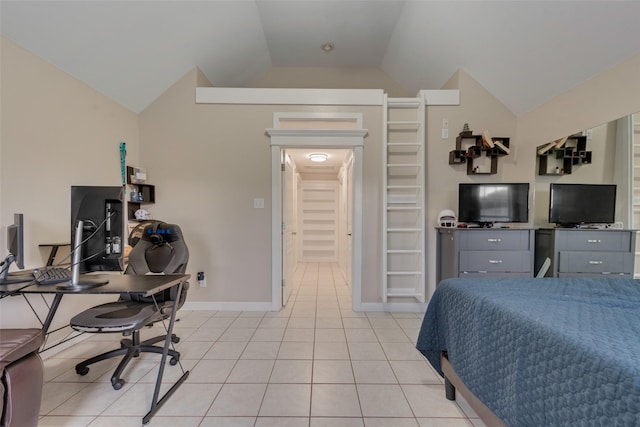 bedroom featuring light tile patterned flooring and vaulted ceiling