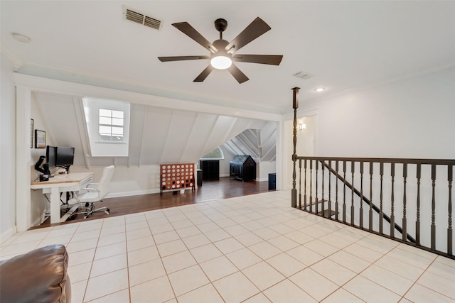 interior space featuring ceiling fan and crown molding