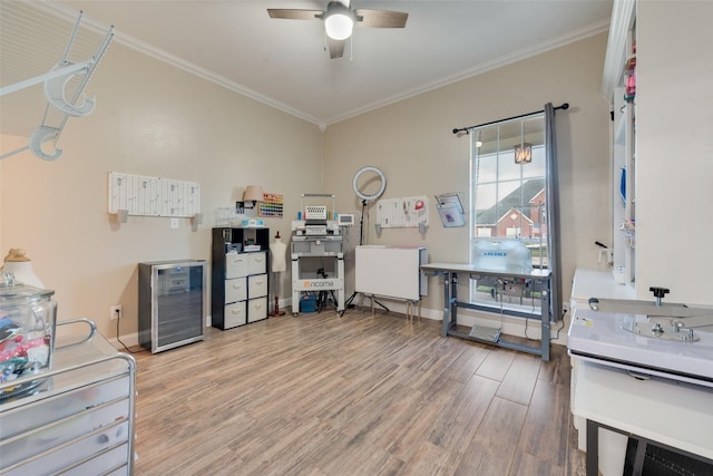 miscellaneous room featuring ceiling fan, hardwood / wood-style flooring, and crown molding