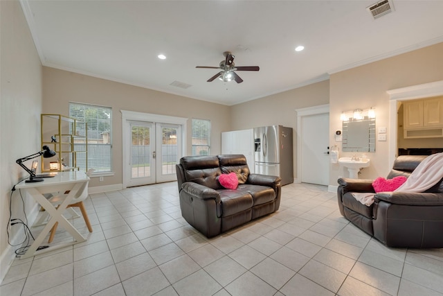 living room with sink, french doors, ceiling fan, light tile patterned floors, and crown molding