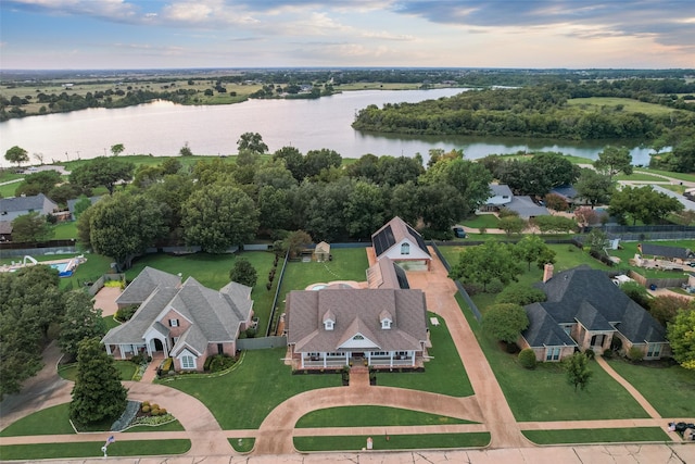 drone / aerial view featuring a water view and a residential view