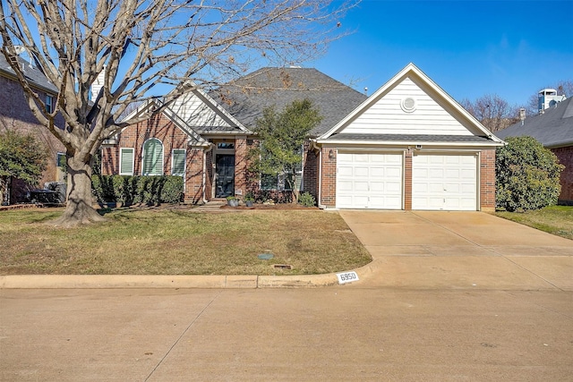 front of property with a front lawn and a garage