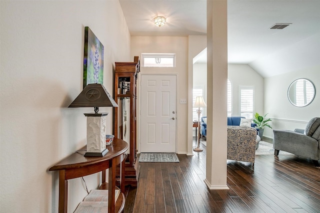 foyer featuring vaulted ceiling and dark hardwood / wood-style floors