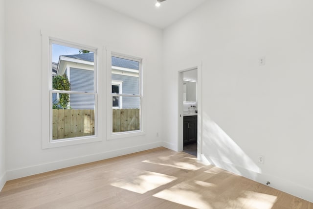 unfurnished room featuring light hardwood / wood-style floors