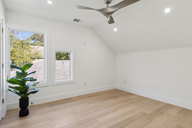 additional living space featuring ceiling fan, light hardwood / wood-style floors, and vaulted ceiling