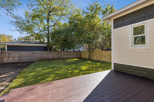 wooden terrace with a lawn