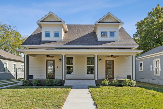 view of front of home featuring ceiling fan, a front lawn, and a porch