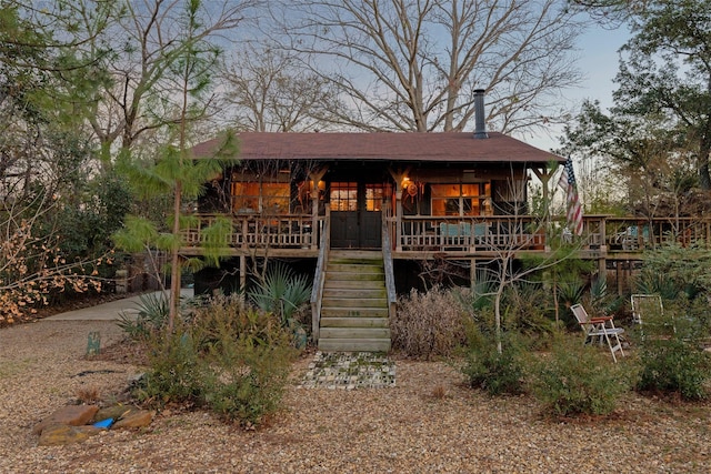 view of front of home featuring a wooden deck