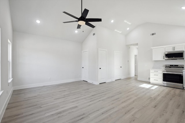 kitchen featuring light hardwood / wood-style floors, ceiling fan, stainless steel appliances, high vaulted ceiling, and white cabinets