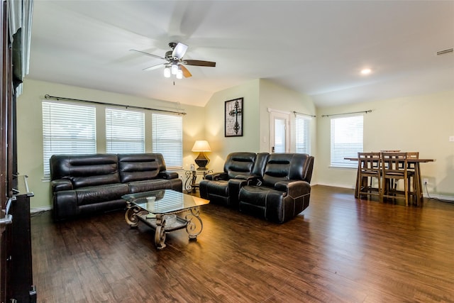 living room featuring lofted ceiling, ceiling fan, and dark wood-type flooring