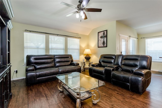 living room featuring ceiling fan, vaulted ceiling, and dark wood-type flooring