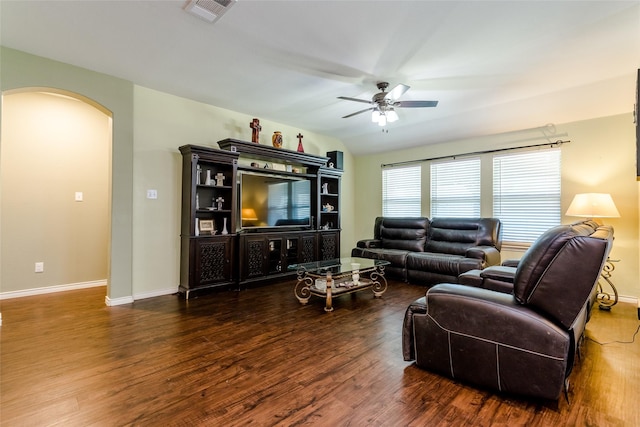 living room with ceiling fan and dark hardwood / wood-style flooring