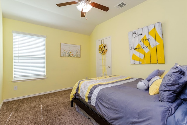 bedroom featuring ceiling fan, vaulted ceiling, and carpet flooring