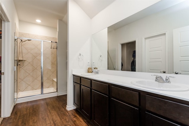 bathroom featuring vanity, a shower with door, and hardwood / wood-style flooring