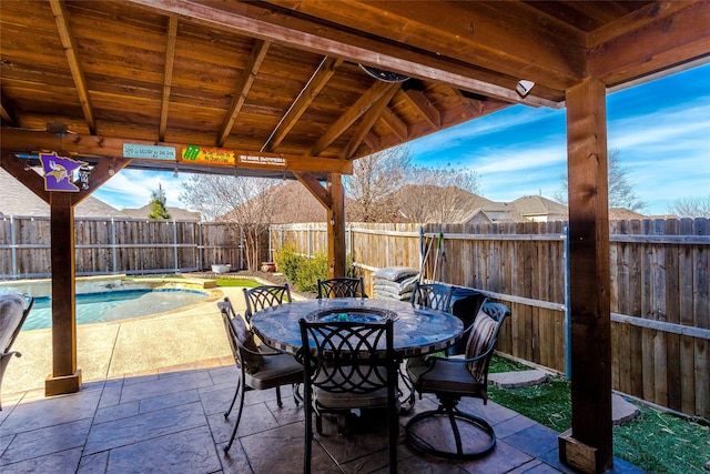 view of patio / terrace with a fenced in pool