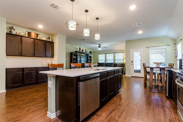 kitchen with stainless steel appliances, an island with sink, sink, hanging light fixtures, and ceiling fan