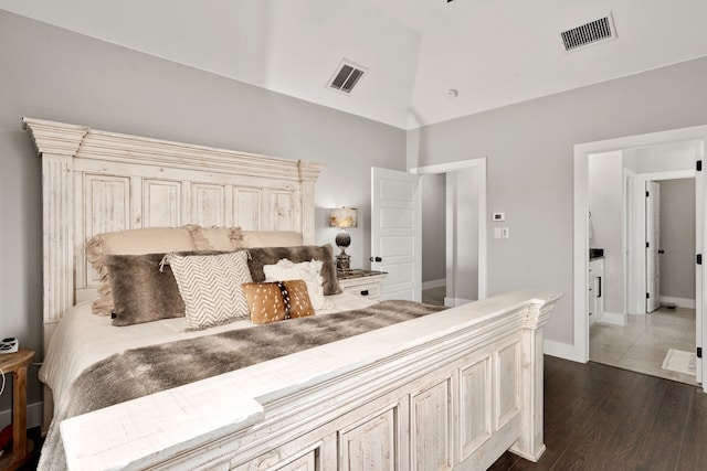 bedroom with dark wood-type flooring