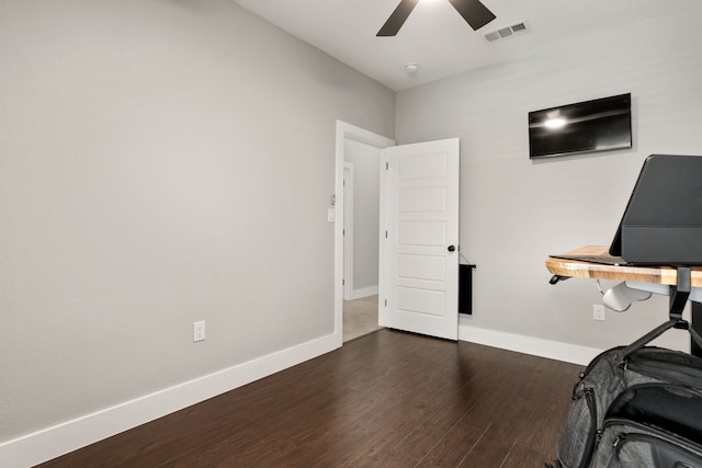 office with dark wood-type flooring and ceiling fan