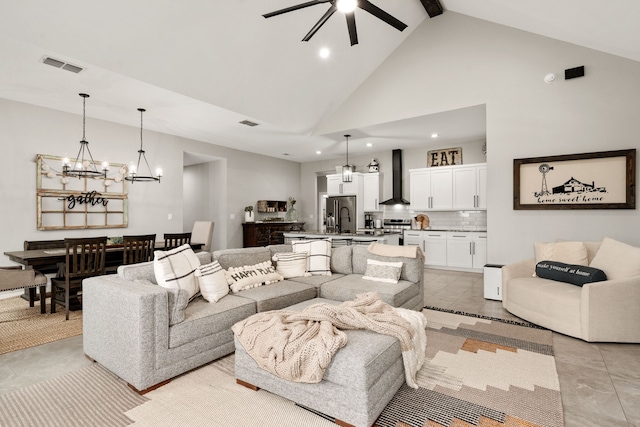 tiled living room with sink, ceiling fan, high vaulted ceiling, and beamed ceiling