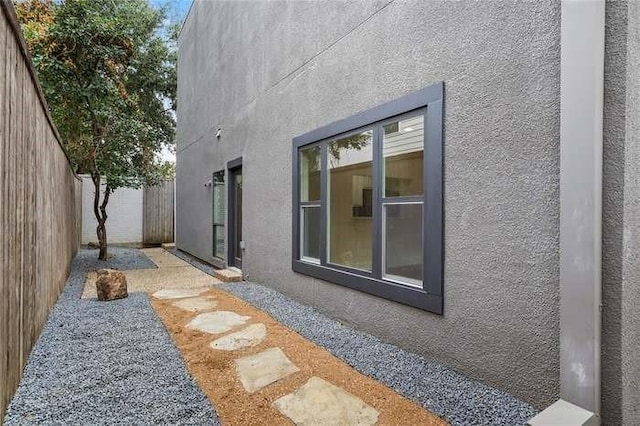 view of side of home featuring a patio area