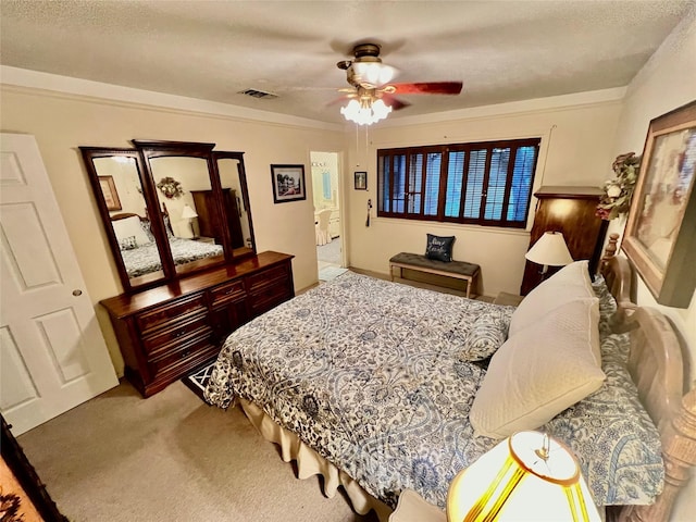 bedroom featuring carpet flooring, a textured ceiling, and ceiling fan