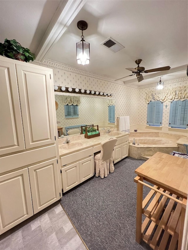 bathroom with ceiling fan, beamed ceiling, and sink