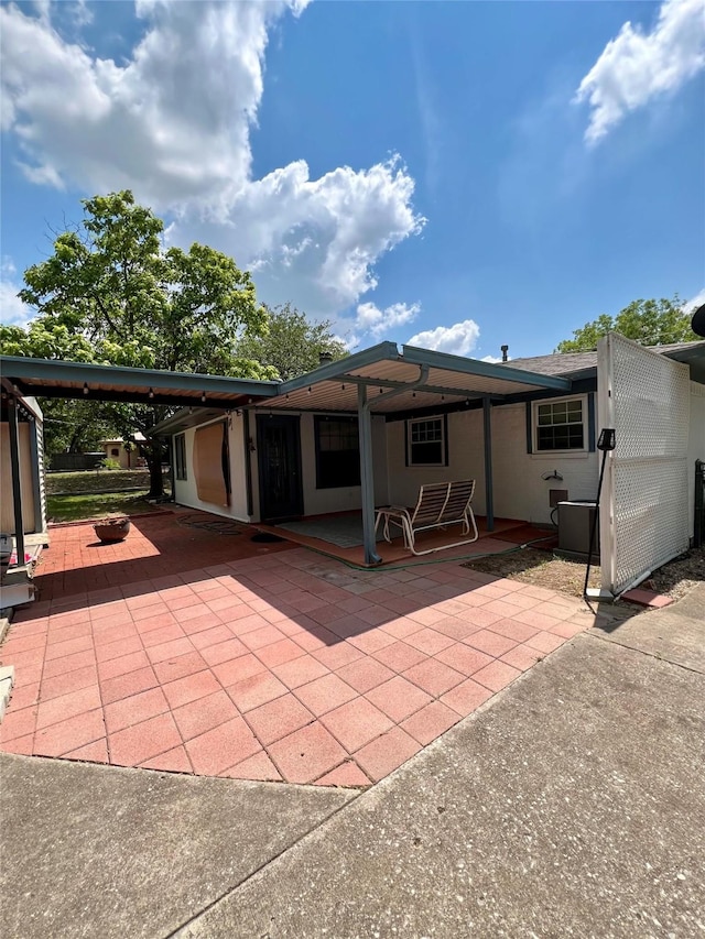 back of property featuring a patio area