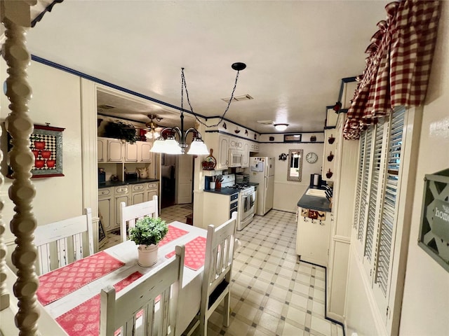 dining space with a notable chandelier