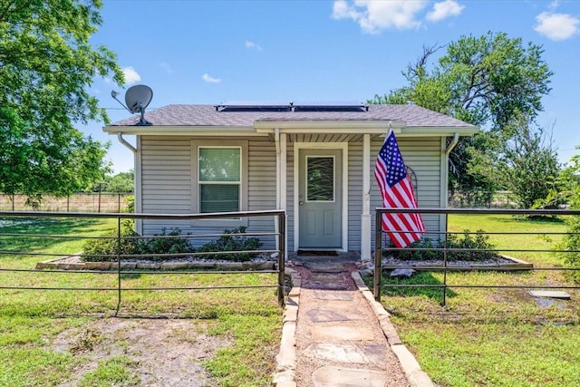 bungalow-style house featuring a front yard