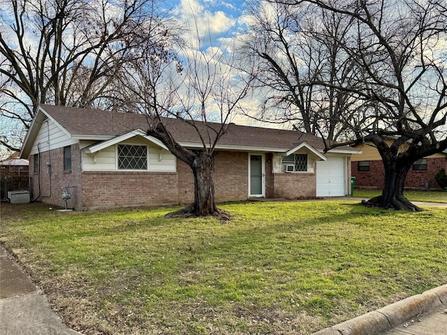 ranch-style house featuring a front lawn and a garage