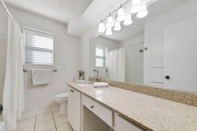 bathroom featuring toilet, vanity, walk in shower, tile patterned floors, and a textured ceiling