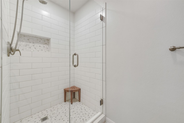 bathroom featuring an enclosed shower