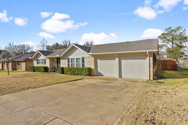 ranch-style house featuring a garage and a front yard